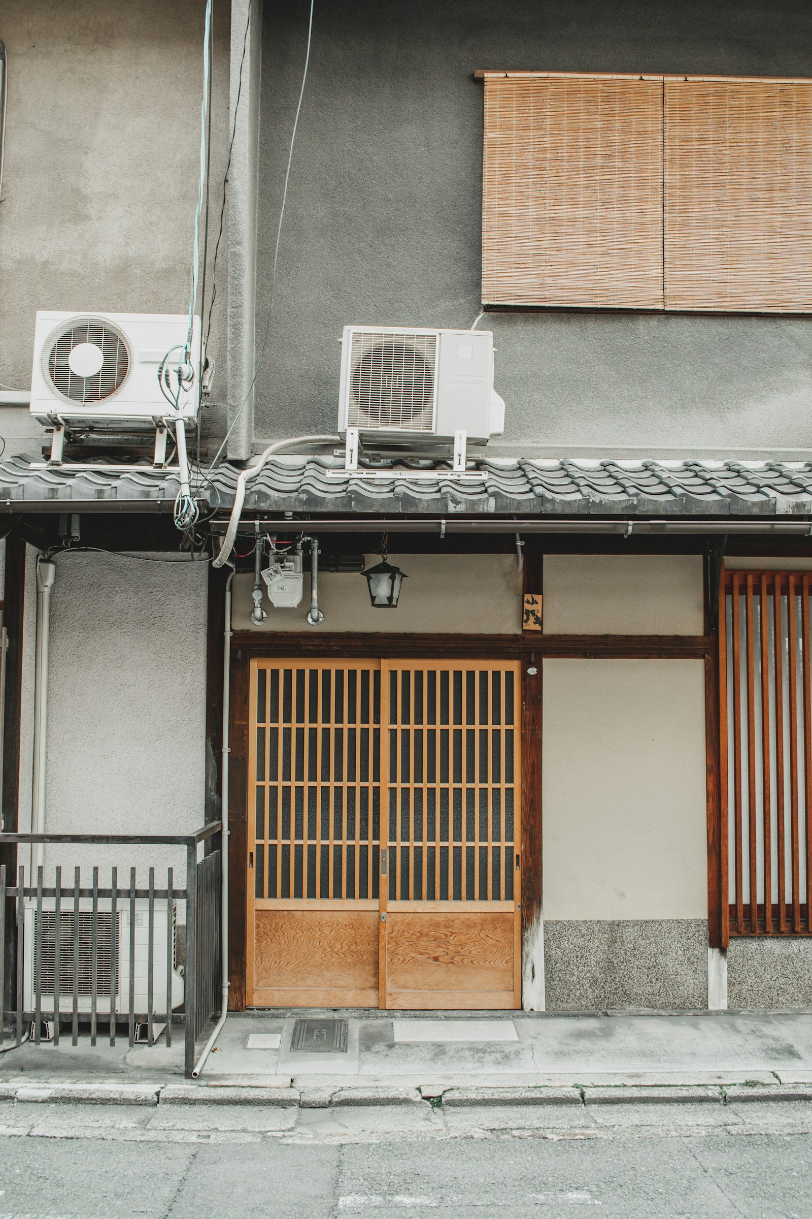 Air-conditioning equipment mounted beside a home