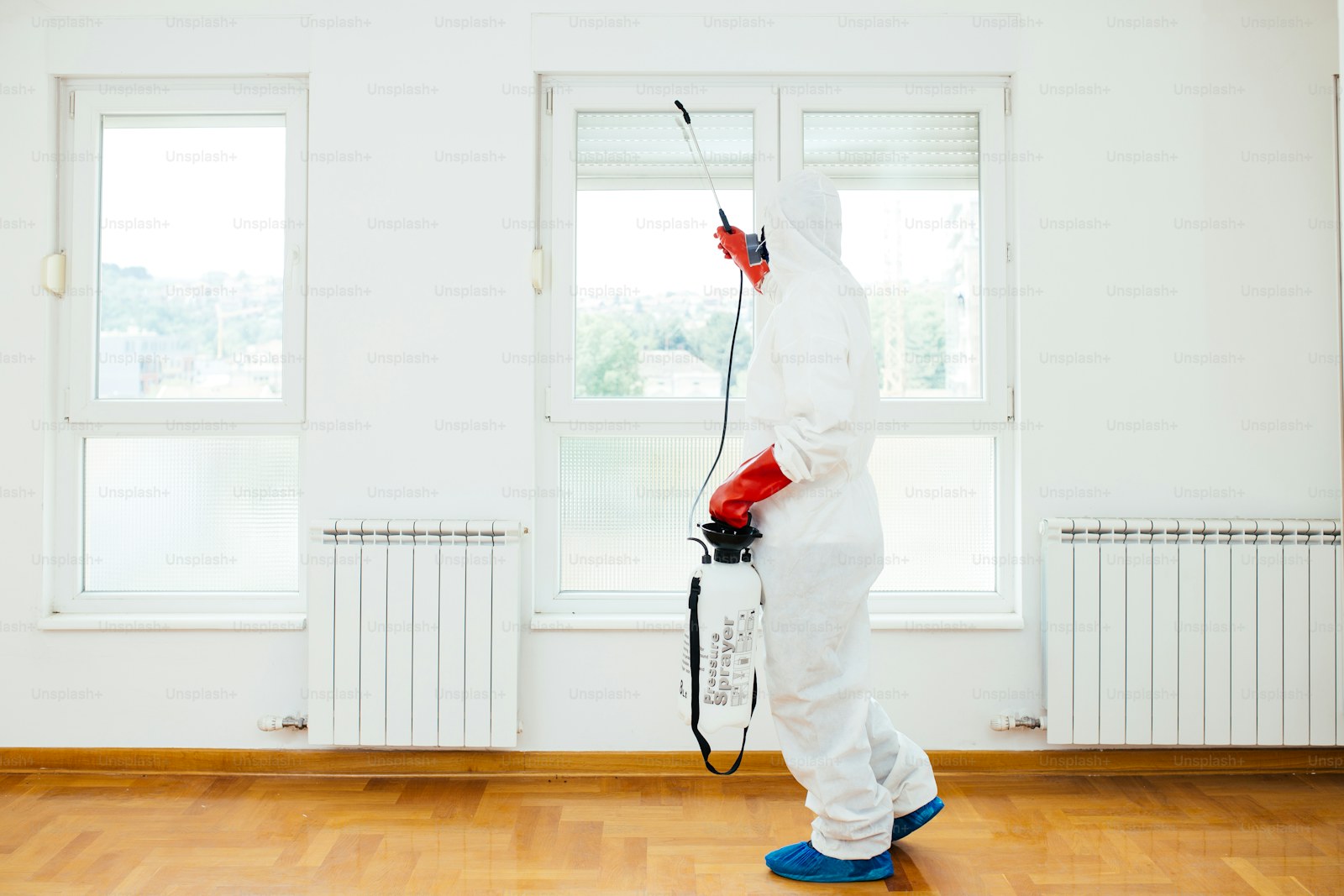 A home service professional inspecting an interior space